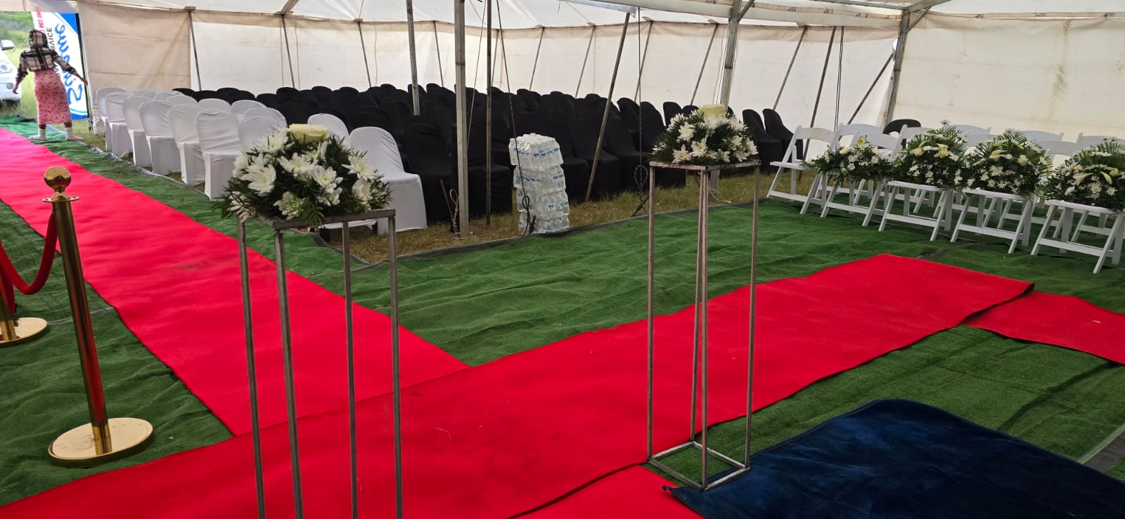 Guest seating and flower stands prepared for a service